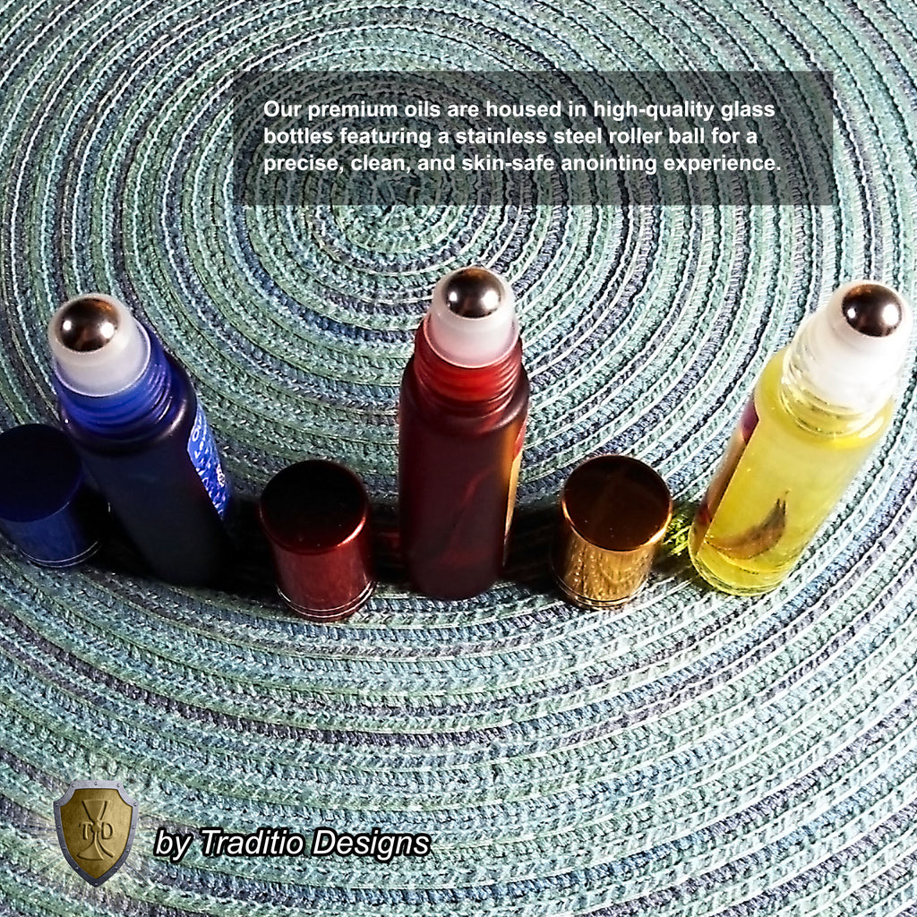 Premium Catholic relic oil bottles in frosted blue, frosted red, and clear glass, shown with caps removed to feature the high-quality stainless steel roller balls for precise and clean anointing.